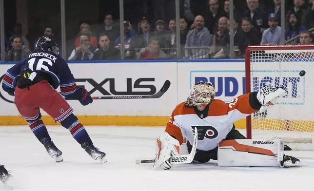 Philadelphia Flyers goaltender Aleksei Kolosov (35) reacts to a puck shot past him for a goal by New York Rangers' Vincent Trocheck (16) during the first period of an NHL hockey game Wednesday, April 9, 2025, in New York. (AP Photo/Frank Franklin II)