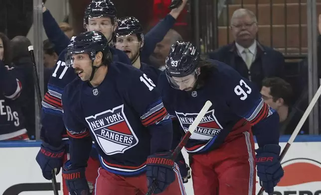 New York Rangers' Vincent Trocheck (16) skates toward his bench with teammates after scoring a goal during the first period of an NHL hockey game against the Philadelphia Flyers Wednesday, April 9, 2025, in New York. (AP Photo/Frank Franklin II)