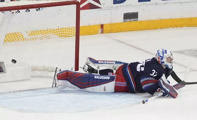New York Rangers goaltender Jonathan Quick (32) reacts as a puck shot by Philadelphia Flyers' Sean Couturier gets past him for a goal during the third period of an NHL hockey game Wednesday, April 9, 2025, in New York. (AP Photo/Frank Franklin II)