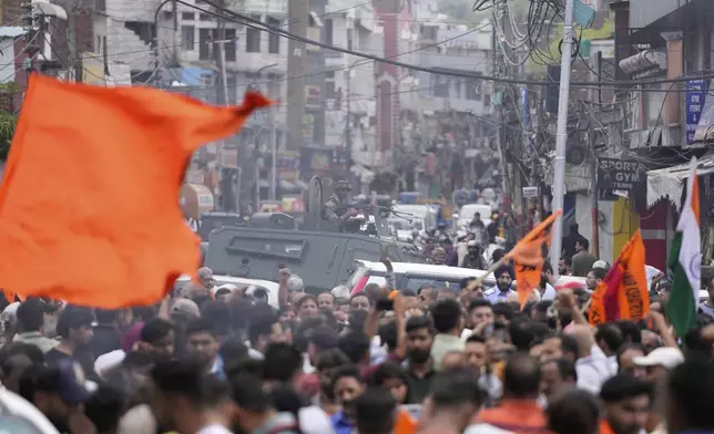 Indian youth gathered and protest against Pakistan during protest against the Pahalgam terror attack in Jammu, India, Wednesday, April.23, 2025.(AP Photo/Channi Anand)