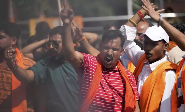 People shout slogans against Pakistan during a protest against the Pahalgam terror attack in Jammu, India, Wednesday, April 23, 2025.(AP Photo/Channi Anand)