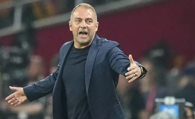 Barcelona's head coach Hansi Flick gestures during the Spanish Copa del Rey final soccer match between Barcelona and Real Madrid at Estadio de La Cartuja stadium in Seville, Spain, Saturday, April 26, 2025. (AP Photo/Jose Breton)