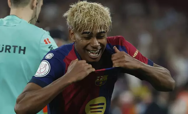 Barcelona's Lamine Yamal celebrates winning the Spanish Copa del Rey final soccer match between Barcelona and Real Madrid at Estadio de La Cartuja stadium in Seville, Spain, Sunday, April 27, 2025. (AP Photo/Joan Monfort)