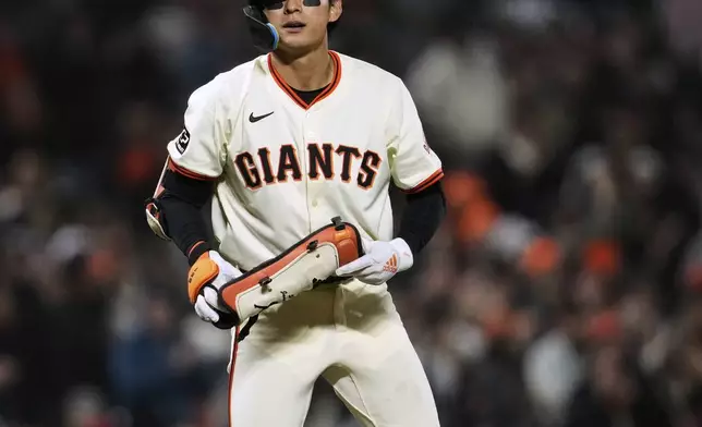 San Francisco Giants' Jung Hoo Lee stands at third after his RBI triple against the Milwaukee Brewers during the seventh inning of a baseball game Monday, April 21, 2025, in San Francisco. (AP Photo/Godofredo A. Vásquez)