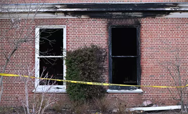 Charred wood trim and brick are visible at the Pennsylvania governor's official residence after a man was arrested in the alleged arson that forced Gov. Shapiro, his family and guests to flee in the middle of the night on the Jewish holiday of Passover, Sunday, Apr. 13, 2025, in Harrisburg, Pa. (AP Photo/Marc Levy)