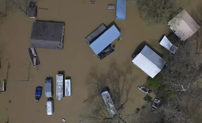 Camp Turn-A-Bout is flooded by the rising Ohio River at the Gunpowder Creek, Monday, April 7, 2025, in Union, Ky. (AP Photo/Carolyn Kaster)