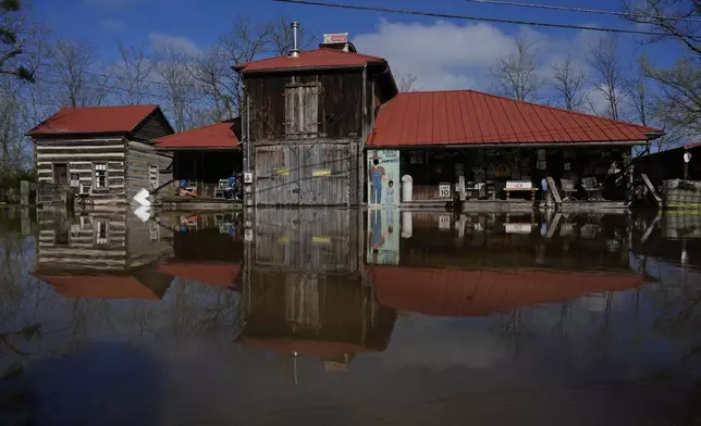 The rising Ohio River floods along Lower River Road, Monday, April 7, 2025, in Rabbit Hash, Ky. (AP Photo/Carolyn Kaster)