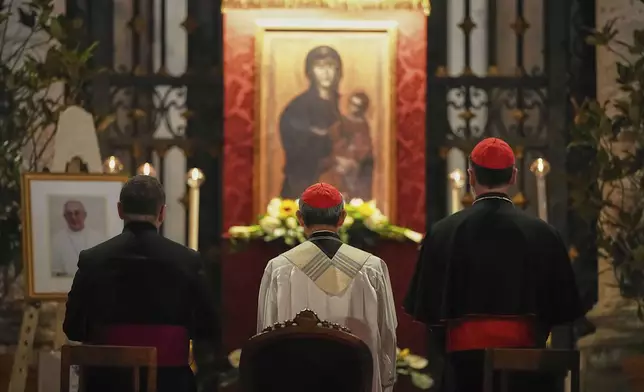 Cardinal Luis Antonio Gokim Tagle, center, leads a rosary prayer outside the Santa Maria Maggiore Basilica, where the late Pope Francis will be buried, in Rome, Thursday, April 24, 2025. (AP Photo/Andreea Alexandru)