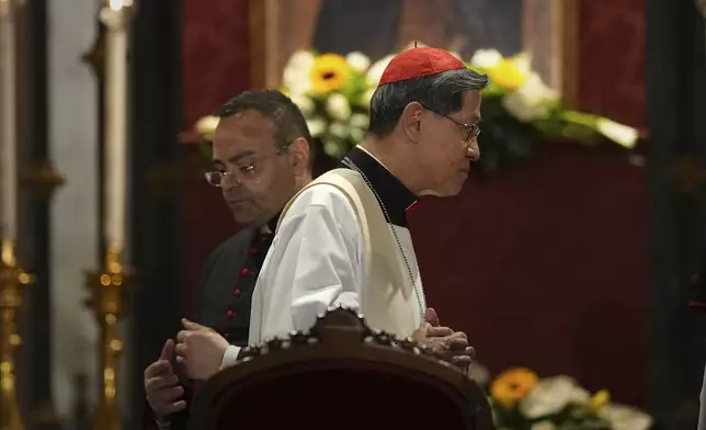 Cardinal Luis Antonio Gokim Tagle, right, leaves after a rosary prayer outside the Santa Maria Maggiore Basilica, where the late Pope Francis will be buried, in Rome, Thursday, April 24, 2025. (AP Photo/Andreea Alexandru)