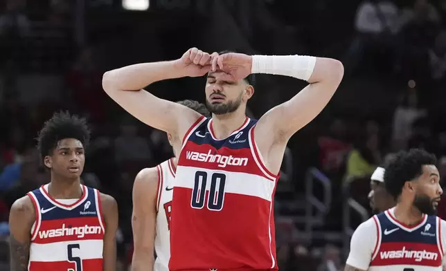 Washington Wizards forward Tristan Vukcevic (00) reacts after a missed a shot during the second half of an NBA basketball game against the Chicago Bulls in Chicago, Friday, April 11, 2025. (AP Photo/Nam Y. Huh)