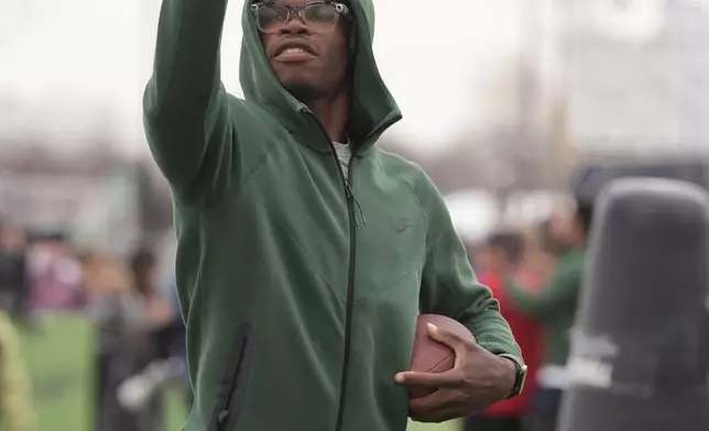 Draft prospect Travis Hunter of Colorado works with local youth football players and Special Olympics athletes during the league's annual prospect clinic ahead of the NFL football draft Wednesday, April 23, 2025, in Green Bay, Wis. (AP Photo/Jeff Roberson)