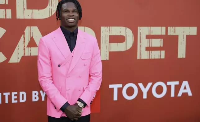 Colorado wide receiver Travis Hunter poses on the carpet before first round of the NFL football draft, Thursday, April 24, 2025, in Green Bay, Wis. (AP Photo/Matt Ludtke)