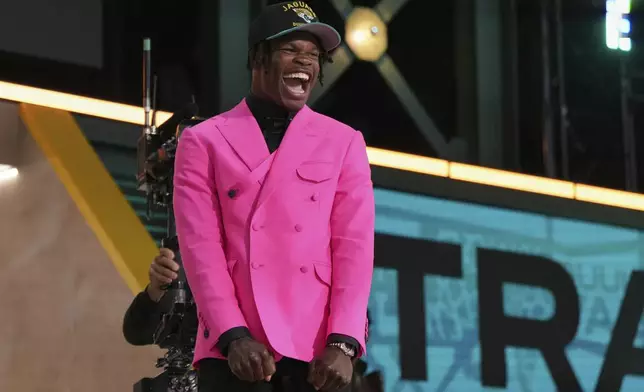 Colorado wide receiver Travis Hunter celebrates after being chosen by the Jacksonville Jaguars with the second overall pick during the first round of the NFL football draft, Thursday, April 24, 2025, in Green Bay, Wis. (AP Photo/Jeff Roberson)