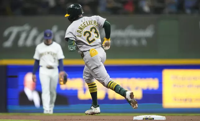 Athletics' Shea Langeliers rounds the bases after hitting a solo home run during the ninth inning of a baseball game against the Milwaukee Brewers, Saturday, April 19, 2025, in Milwaukee. (AP Photo/Aaron Gash)