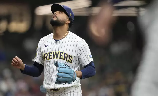 Milwaukee Brewers' Joel Payamps reacts as he walks to the dugout during the ninth inning of a baseball game against the Athletics, Saturday, April 19, 2025, in Milwaukee. (AP Photo/Aaron Gash)