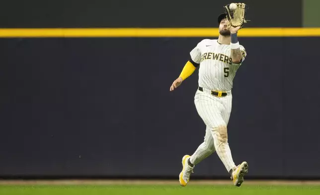 Milwaukee Brewers' Garrett Mitchell catches a fly ball during the seventh inning of a baseball game against the Athletics, Saturday, April 19, 2025, in Milwaukee. (AP Photo/Aaron Gash)