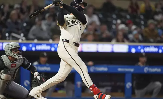 Minnesota Twins' Trevor Larnach (9) hits a 2-run home run during the eighth inning of a baseball game against the Chicago White Sox,Tuesday, April 22, 2025, in Minneapolis. (AP Photo/Abbie Parr)