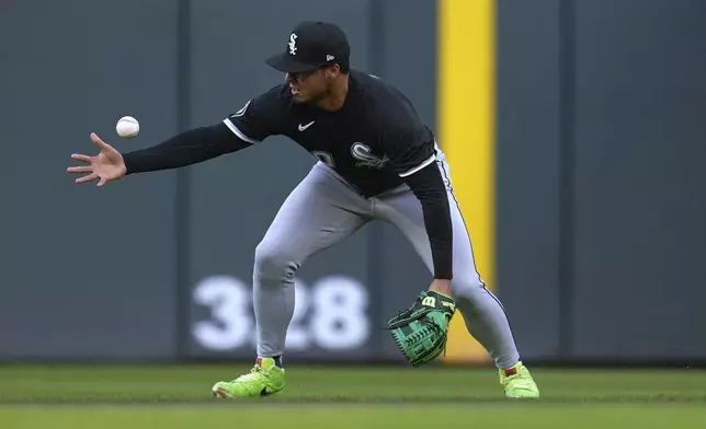 Chicago White Sox second baseman Lenyn Sosa (50) fields a groundout hit by Minnesota Twins' Edouard Julien (47) during the first inning of a baseball game Tuesday, April 22, 2025, in Minneapolis. (AP Photo/Abbie Parr)