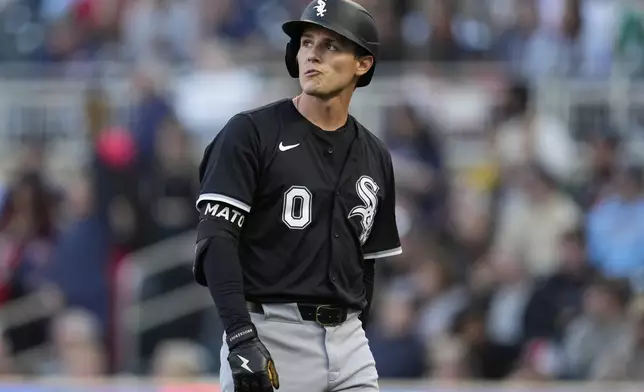 Chicago White Sox's Nick Maton (0) walks back to the dugout after striking out during the second inning of a baseball game against the Minnesota Twins, Tuesday, April 22, 2025, in Minneapolis. (AP Photo/Abbie Parr)