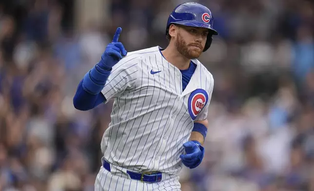 CORRECTS TO CARSON KELLY NOT KYLE TUCKER - Chicago Cubs' Carson Kelly runs the bases after hitting a three-run home run during the eighth inning of a baseball game against the Arizona Diamondbacks, Friday, April 18, 2025, in Chicago. (AP Photo/Erin Hooley)