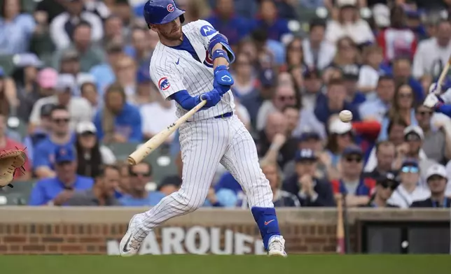 CORRECTS TO CARSON KELLY NOT KYLE TUCKER - Chicago Cubs' Carson Kelly hits a three-run home run during the eighth inning of a baseball game against the Arizona Diamondbacks, Friday, April 18, 2025, in Chicago. (AP Photo/Erin Hooley)