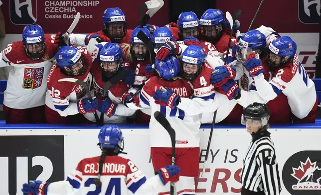 Dominika Laskova of Czech Republic celebrates with teammates after scoring her sides third goal during the bronze medal match between Czech Republic and Finland at the Women's Ice Hockey Championships in Ceske Budejovice, Czech Republic, Sunday, April 20, 2025. (AP Photo/Petr David Josek)