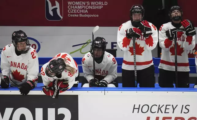 Canada players stand dejected after the gold medal match between Canada and United States at the Women's Ice Hockey Championships in Ceske Budejovice, Czech Republic, Sunday, April 20, 2025. (AP Photo/Petr David Josek)