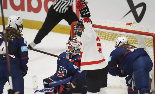 Canada's Emily Clark celebrate after a goal during the gold medal match between Canada and United States at the Women's Ice Hockey Championships in Ceske Budejovice, Czech Republic, Sunday, April 20, 2025. (AP Photo/Petr David Josek)