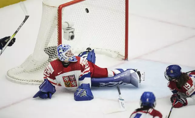 Klara Peslarova of Czech Republic fails to make a save during the bronze medal match between Czech Republic and Finland at the Women's Ice Hockey Championships in Ceske Budejovice, Czech Republic, Sunday, April 20, 2025. (AP Photo/Petr David Josek)