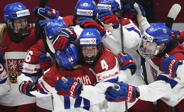 Dominika Laskova of Czech Republic celebrates with teammates after scoring her sides third goal during the bronze medal match between Czech Republic and Finland at the Women's Ice Hockey Championships in Ceske Budejovice, Czech Republic, Sunday, April 20, 2025. (AP Photo/Petr David Josek)