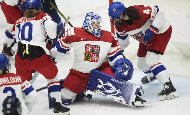 Klara Peslarova of Czech Republic makes a save during the bronze medal match between Czech Republic and Finland at the Women's Ice Hockey Championships in Ceske Budejovice, Czech Republic, Sunday, April 20, 2025. (AP Photo/Petr David Josek)