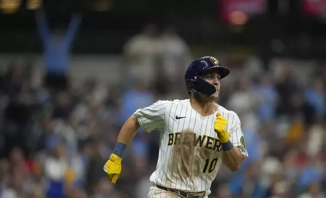 Milwaukee Brewers' Sal Frelick runs to first base after hitting an RBI single during the fifth inning of a baseball game against the Cincinnati Reds, Saturday, April 5, 2025, in Milwaukee. (AP Photo/Aaron Gash)