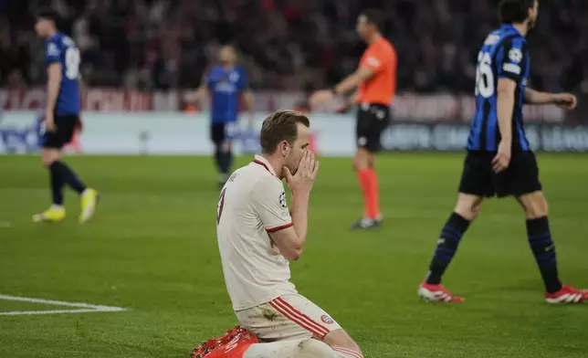 Bayern's Harry Kane reacts after missing a chance to score during the Champions League quarterfinals first leg soccer match between FC Bayern Munich and Inter Milan, at the Allianz Arena in Munich, Germany, Tuesday, April 8, 2025. (AP Photo/Matthias Schrader)
