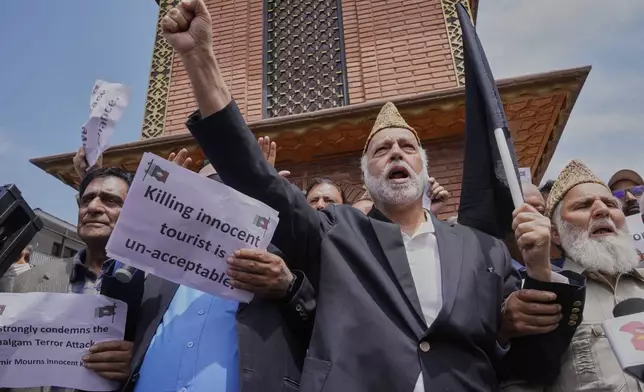Members of Jammu and Kashmir Awami National Conference shout slogans during a protest after a deadly attack that killed 26 people, mostly tourists, in Srinagar, Indian controlled Kashmir, Thursday, April. 24, 2025. (AP Photo/Dar Yasin)