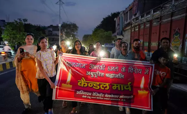 People attend a protest and solidarity march after tourists were killed near Pahalgam in Indian controlled Kashmir, northern Indian state of Uttar Pradesh, Saturday, April 26,2025. (AP Photo/Rajesh Kumar Singh)