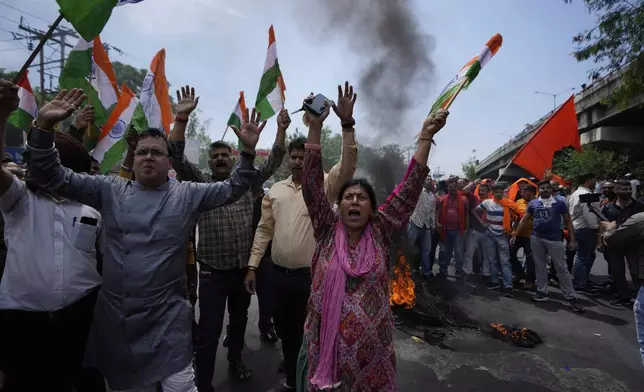 People shout slogans against Pakistan during a protest against the Pahalgam terror attack in Jammu, India, Wednesday, April 23, 2025.(AP Photo/Channi Anand)