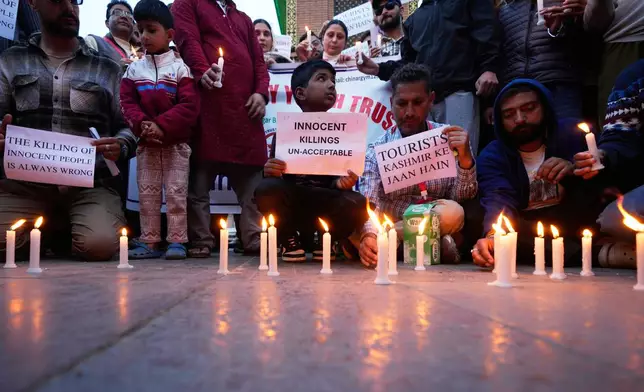 People participate during a candlelight protest after tourists were killed in Srinagar, Indian controlled Kashmir, Wednesday, April. 23, 2025. (AP Photo/Mukhtar Khan)
