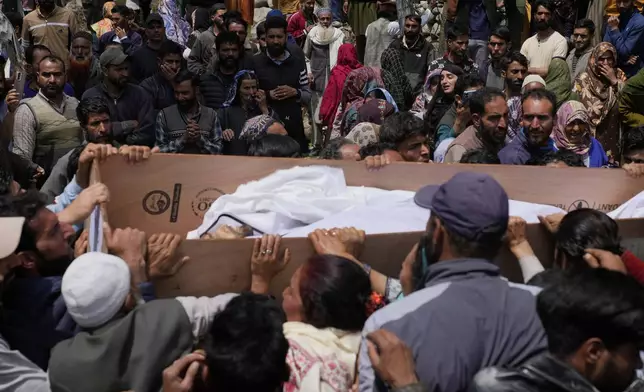 The body of Adil Hussain Shah, a daily-wage worker, who was killed when militants indiscriminately opened fire on a crowd of mainly tourists on Tuesday, is carried for burial at his village Hapatnar, about 20 km (13 miles) from Pahalgam where the incident took place, Indian controlled Kashmir, Wednesday, April 23, 2025. (AP Photo/Dar Yasin)