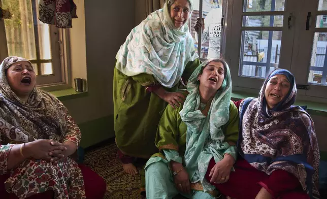 Relatives of Ahsan Ul Haq Shiekh, a militant who officials say is involved in the deadly attack on tourists in Pahalgam, wail after after Indian forces blew up the family home at Murran village in Pulwama, south of Srinagar, Indian controlled Kashmir, Saturday, April 26, 2025. (AP Photo/Dar Yasin)