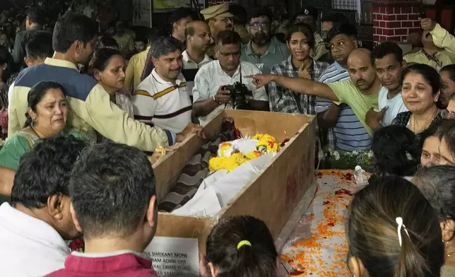 Mourners pay last respect to Atul Mone, victim in a deadly attack on tourists in the Pahalgam region of Indian-administered Kashmir, at Dombivali near Mumbai, India, Wednesday, April. 23, 2025.(AP Photo/Rajanish Kakade)