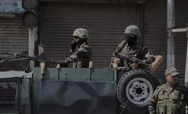 Indian soldiers guard after tourists were killed in Srinagar, Indian controlled Kashmir, Wednesday, April. 23, 2025. (AP Photo/Mukhtar Khan)