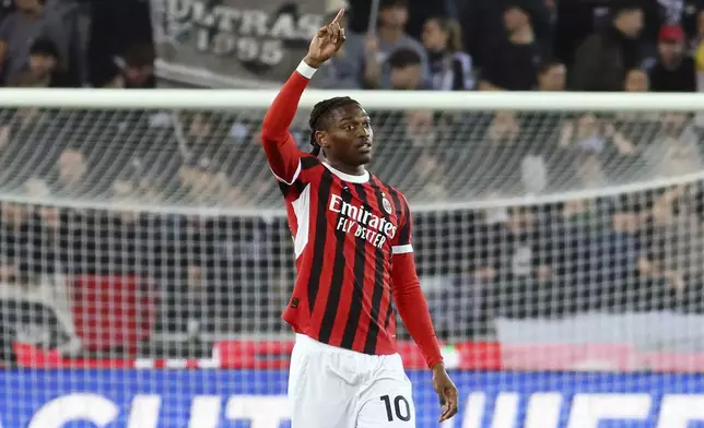AC Milan's Rafael Leao celebrates scoring during the Serie A soccer match between Udinese and Milan at the Bluenergy Stadium in Udine, Italy, Friday April 11, 2025. (Andrea Bressanutti/LaPresse via AP)
