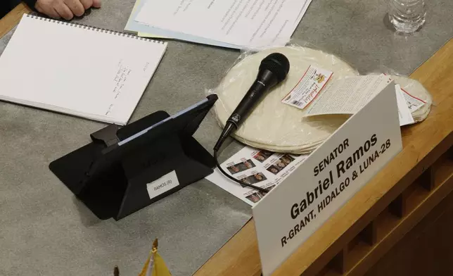 Locally made tortillas rest on desks of New Mexico legislators at the state Senate debates a bill to designate tortillas a the official state bread in Santa Fe, on Tuesday, March 18, 2025. (AP Photo/Morgan Lee)