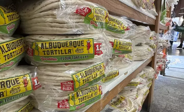 Packages of tortillas line shelves at a grocery store in Albuquerque, New Mexico, on Thursday, April 10, 2025. (AP Photo/Susan Montoya Bryan)