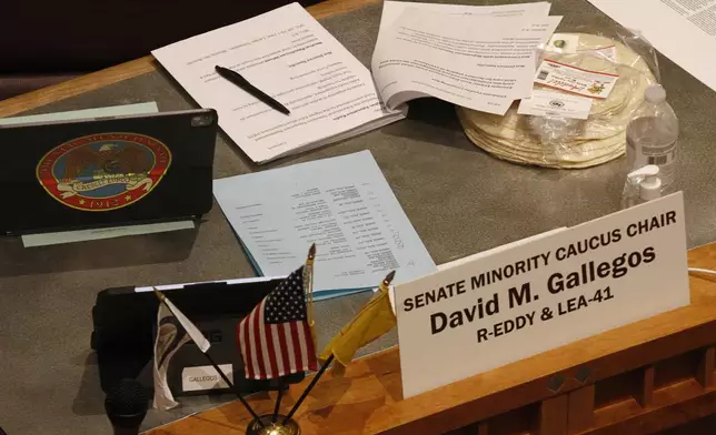 Locally made tortillas rest on the desks of New Mexico legislators as the state Senate debates a bill to designate tortillas as the official state bread in Santa Fe, N.M., on Tuesday, March 18, 2025. (AP Photo/Morgan Lee)