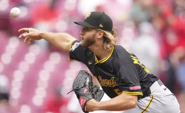 Pittsburgh Pirates pitcher Carmen Mlodzinski throws during the first inning of a baseball game against the Cincinnati Reds, Sunday, April 13, 2025, in Cincinnati. (AP Photo/Jeff Dean)