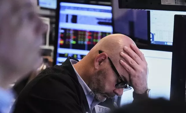 Trader Fred Demarco works on the floor of the New York Stock Exchange, Monday, April 21, 2025. (AP Photo/Richard Drew)