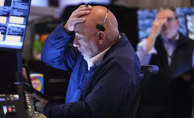 Trader Vincent Napolitano works on the floor of the New York Stock Exchange, Thursday, April 24, 2025. (AP Photo/Richard Drew)