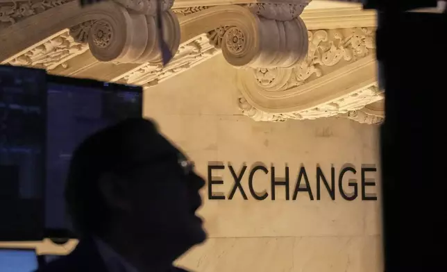Specialist Patrick King works at his post on the floor of the New York Stock Exchange, Tuesday, April 22, 2025. (AP Photo/Richard Drew)