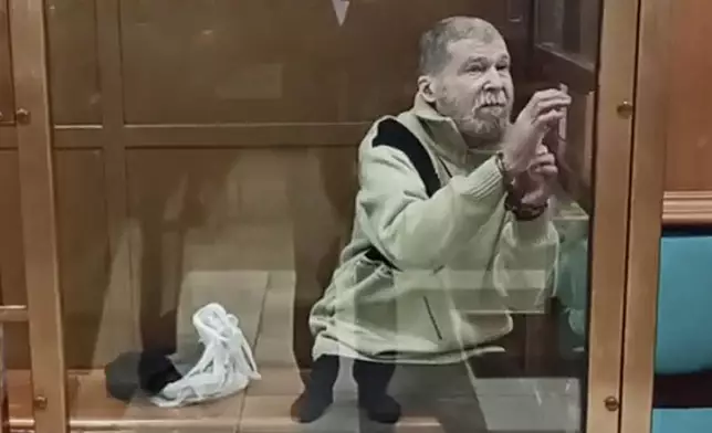 FILE - In this photo taken from video released by the Moscow City Court Press Service, Stephen Hubbard, a U.S. citizen accused of fighting as a mercenary in Ukraine against Russia stands in a glass cage during a court session in the Moscow City court in Moscow, Russia, Oct. 7, 2024. (Moscow City Court Press Service via AP, File)